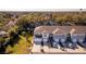 Aerial view of townhouses with attached garages and surrounding landscape at 2033 Canny Cv, Winter Park, FL 32792