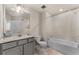 Clean bathroom featuring a bathtub and updated vanity at 2033 Canny Cv, Winter Park, FL 32792