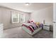 Bright bedroom with white bed frame and patterned bedding at 2033 Canny Cv, Winter Park, FL 32792