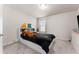 Cozy bedroom with a white bed frame and black bedding at 2033 Canny Cv, Winter Park, FL 32792