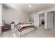 Spacious bedroom with a white bed frame, built in dresser, and an attached bath at 2033 Canny Cv, Winter Park, FL 32792