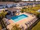 Community pool with lounge chairs and a covered patio area at 2033 Canny Cv, Winter Park, FL 32792