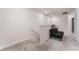 Upstairs hallway with a futon and access to laundry and bedrooms at 2033 Canny Cv, Winter Park, FL 32792