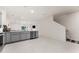 Modern kitchen features gray cabinets, stainless steel appliances, and an island at 2033 Canny Cv, Winter Park, FL 32792