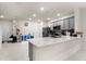 Modern kitchen with gray cabinets and an open layout to dining area at 2033 Canny Cv, Winter Park, FL 32792