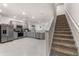 Open concept kitchen with gray cabinets and stainless steel appliances at 2033 Canny Cv, Winter Park, FL 32792
