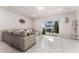 Comfortable living room with sectional sofa and sliding glass doors to patio at 2033 Canny Cv, Winter Park, FL 32792