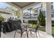 Private patio with a table and chairs, perfect for outdoor dining at 2033 Canny Cv, Winter Park, FL 32792