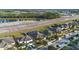 Community view showcasing homes and a lake at 2158 Stillwood Way, St Cloud, FL 34771