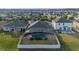 Aerial view of house with pool and screened enclosure at 2158 Stillwood Way, St Cloud, FL 34771