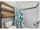 Bathroom with a shower/tub combo and shelving at 2158 Stillwood Way, St Cloud, FL 34771