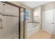 Bathroom with tub, shower, and linen closet at 2158 Stillwood Way, St Cloud, FL 34771