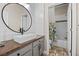 Bathroom with wood vanity, vessel sink, and shower/tub combo at 2158 Stillwood Way, St Cloud, FL 34771