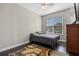 Bedroom with double bed, dresser, and ceiling fan at 2158 Stillwood Way, St Cloud, FL 34771