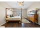 Bedroom with canopy bed, dresser, and ceiling fan at 2158 Stillwood Way, St Cloud, FL 34771