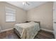 Bedroom with double bed, window, and ceiling fan at 2158 Stillwood Way, St Cloud, FL 34771