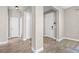 View of entryway from living room, showcasing flooring and doors at 2158 Stillwood Way, St Cloud, FL 34771