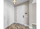 Entryway with herringbone tile floor and shiplap wall at 2158 Stillwood Way, St Cloud, FL 34771
