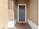 Gray front door with a welcome mat at 2158 Stillwood Way, St Cloud, FL 34771