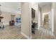 Home hallway with built-in desk, view of living room and bathroom at 2158 Stillwood Way, St Cloud, FL 34771