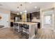 Open concept kitchen with island and breakfast bar seating at 2158 Stillwood Way, St Cloud, FL 34771