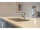 Modern kitchen with double sink and sleek countertops at 2158 Stillwood Way, St Cloud, FL 34771