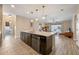 Spacious kitchen with island, stainless steel appliances, and dark wood cabinets at 2158 Stillwood Way, St Cloud, FL 34771