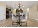 Kitchen nook with a small round table and four light beige chairs at 2158 Stillwood Way, St Cloud, FL 34771