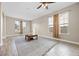 Living area with neutral walls, tile floors, and large windows offering natural light at 2158 Stillwood Way, St Cloud, FL 34771