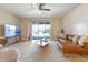 Spacious living room with a sectional sofa and sliding doors at 2158 Stillwood Way, St Cloud, FL 34771