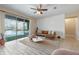 Gathering room with leather sectional, sliding glass doors, and a view of the pool at 2158 Stillwood Way, St Cloud, FL 34771