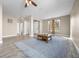 Spacious living room with tile floors, a ceiling fan, and access to the backyard pool at 2158 Stillwood Way, St Cloud, FL 34771