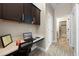 Home office features built-in cabinetry and bathroom access at 2158 Stillwood Way, St Cloud, FL 34771