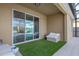 Screened patio with artificial turf and seating at 2158 Stillwood Way, St Cloud, FL 34771
