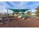 Community playground with shade cover and playset at 2158 Stillwood Way, St Cloud, FL 34771