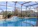 Inviting screened pool with waterfall feature and spacious deck at 2158 Stillwood Way, St Cloud, FL 34771