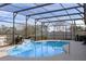 Inviting screened pool with waterfall feature and spacious deck at 2158 Stillwood Way, St Cloud, FL 34771