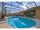 Inviting screened pool with waterfall feature and spacious deck at 2158 Stillwood Way, St Cloud, FL 34771