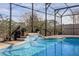 Inviting screened pool with waterfall feature and spacious deck at 2158 Stillwood Way, St Cloud, FL 34771