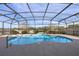 Inviting screened pool with waterfall feature and spacious deck at 2158 Stillwood Way, St Cloud, FL 34771