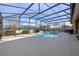 Inviting screened pool with waterfall feature and spacious deck at 2158 Stillwood Way, St Cloud, FL 34771