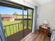 Bedroom with sliding door to balcony overlooking lawn at 230 La Casa # 230, Lake Wales, FL 33898