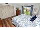 King-size bed, wood floors, and sliding door to balcony at 230 La Casa # 230, Lake Wales, FL 33898