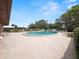 Kidney-shaped pool with surrounding patio and lounge chairs at 230 La Casa # 230, Lake Wales, FL 33898