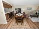 Bright dining area with wood flooring and a view of the kitchen at 230 La Casa # 230, Lake Wales, FL 33898