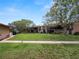 Two story condo building with a grassy area and walkway at 230 La Casa # 230, Lake Wales, FL 33898