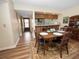 Open concept kitchen and dining area with wood flooring at 230 La Casa # 230, Lake Wales, FL 33898