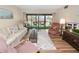 Living room with sliding doors leading to a balcony at 230 La Casa # 230, Lake Wales, FL 33898