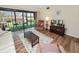 Living room with access to a balcony overlooking green space at 230 La Casa # 230, Lake Wales, FL 33898