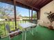 Relaxing screened balcony with patio furniture and view of green space at 230 La Casa # 230, Lake Wales, FL 33898